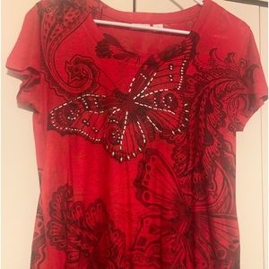 Cute light weight red blouse with detailed butterflies with some stone detail.